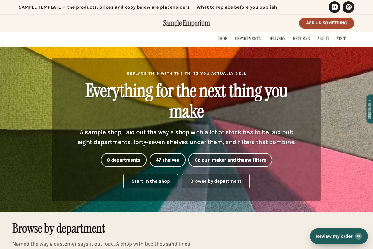 The Emporium starter's home page: a photographic hero over eight department tiles